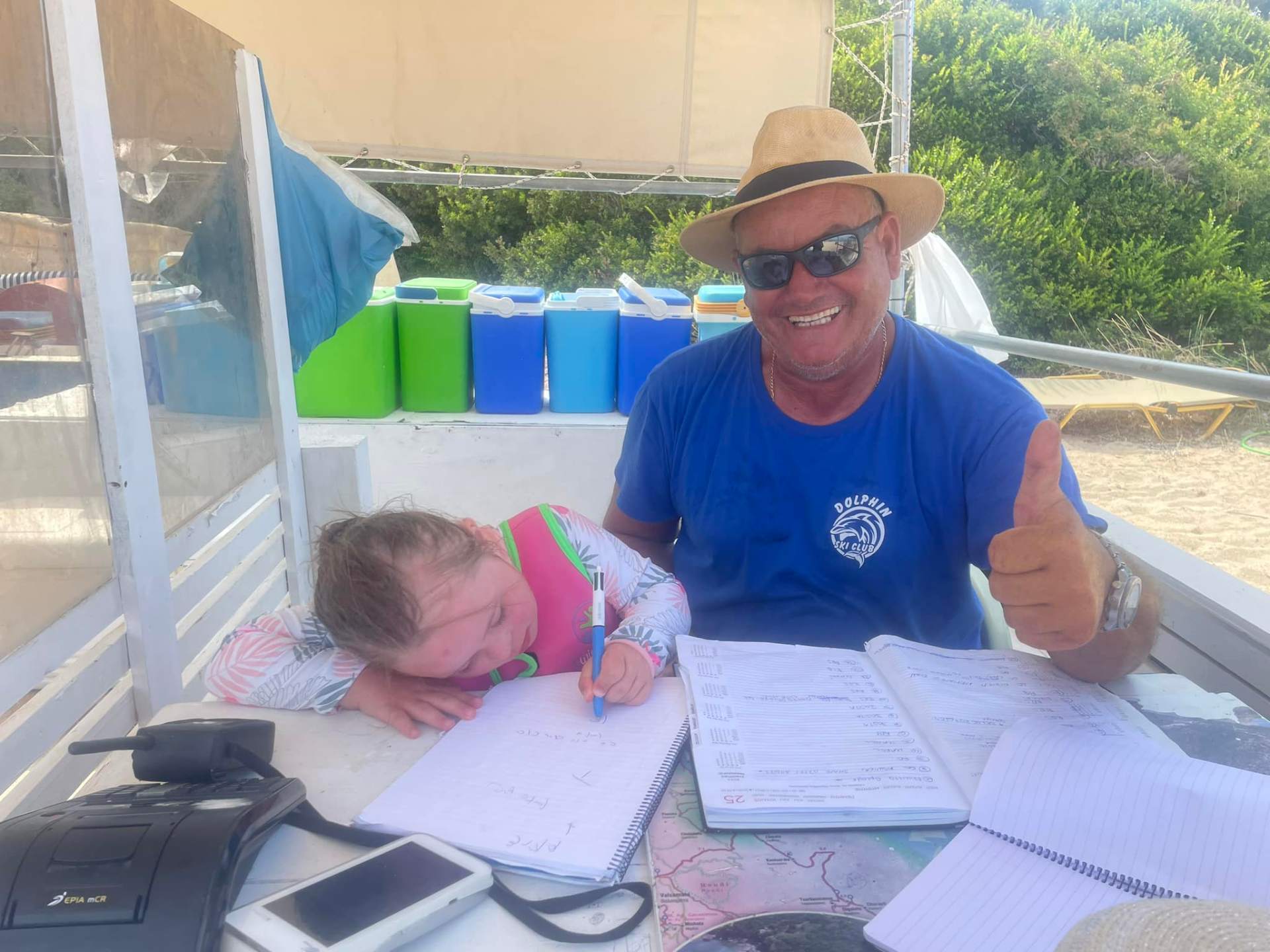 A Dolphin Ski Club staff member with a young guest