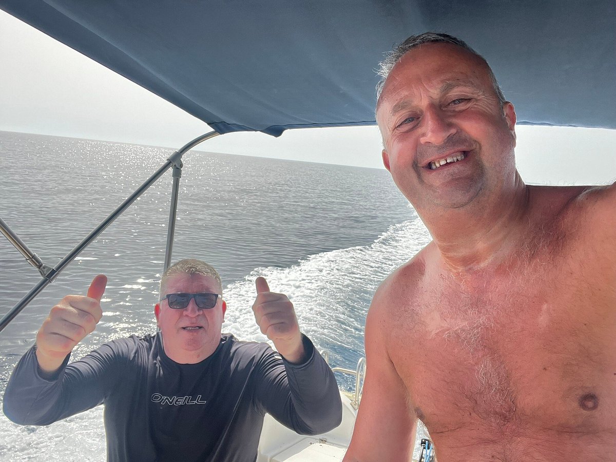 Two guests giving thumbs up on a boat off Kefalonia